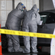 Workers in protective gear operate a drive through COVID-19 mobile testing center on March 13, 2020 in New Rochelle, New York.